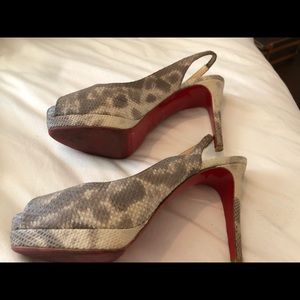 Peep top python Christian Louboutin pumps.